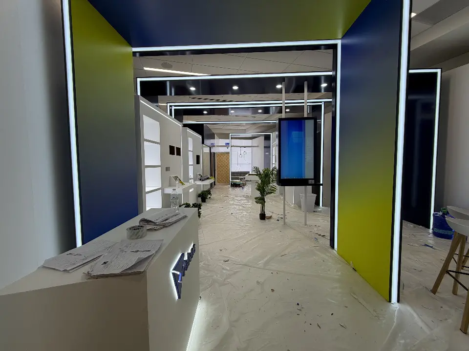 Valens CES 2026 entrance with navy and lime portal frames outlined in light strips, during installation