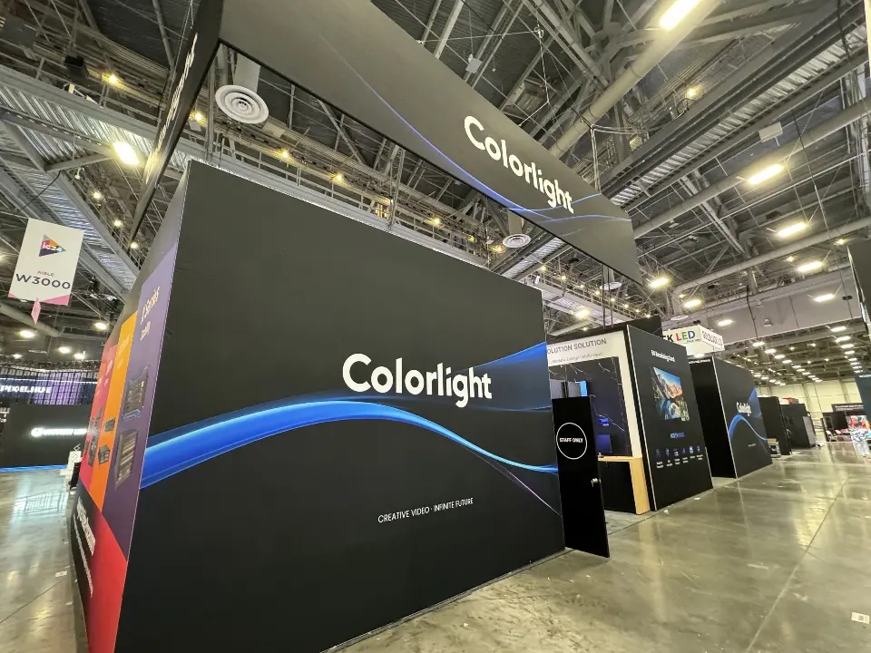 Black corner wall with blue swoosh graphic and white Colorlight logo