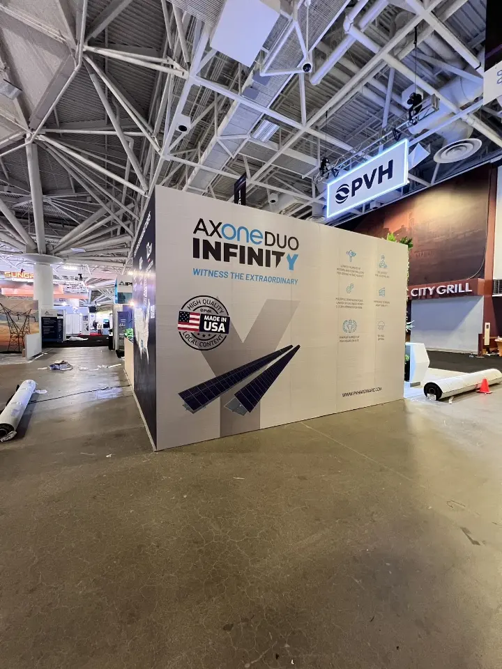 Outer wall graphic presenting AXONE DUO INFINITY with a paper-plane motif