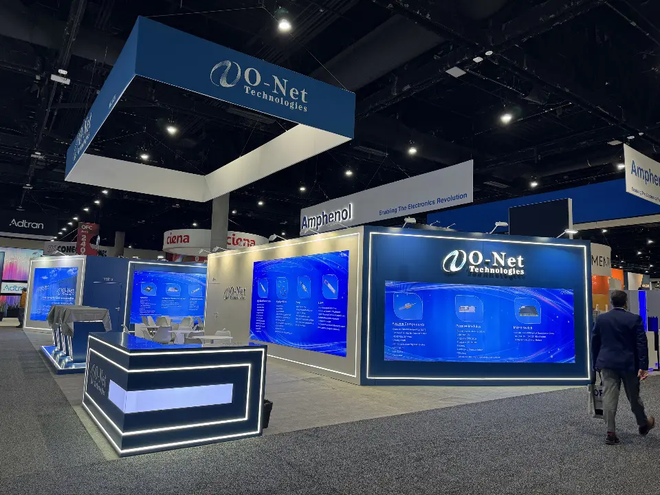 O-Net booth with square hanging sign, product graphics and a lit reception counter