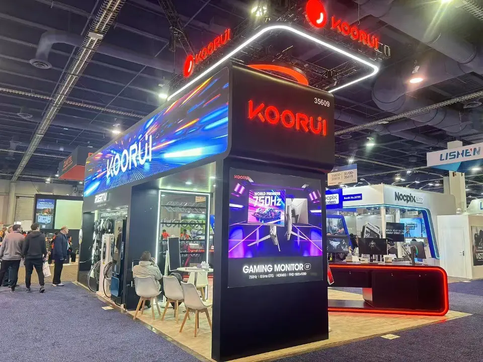 Black KOORUI tower with gaming monitor graphics under a curved video header