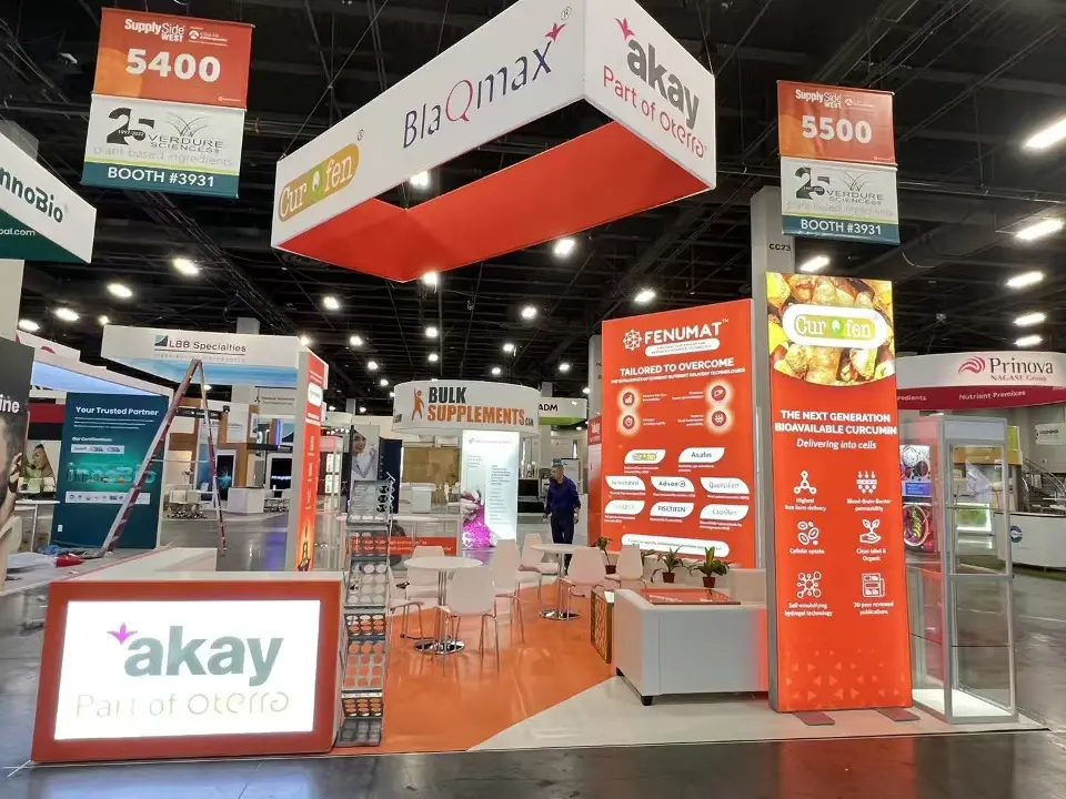 Wide view of the open island with BlaQmax header, counter and glass displays