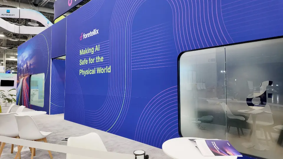 Exterior wall with the Making AI Safe tagline and frosted meeting room glass