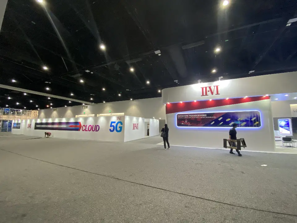 Wide view of the booth front with red fascia band