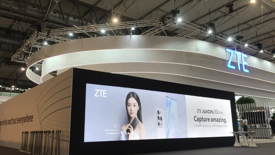 Phone campaign on a wide screen under the canopy with ZTE logo on the right