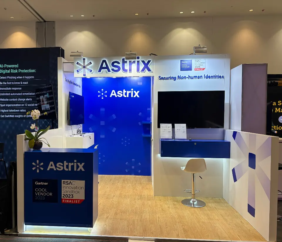 Straight-on view of the blue Astrix wall, side screen and white stool