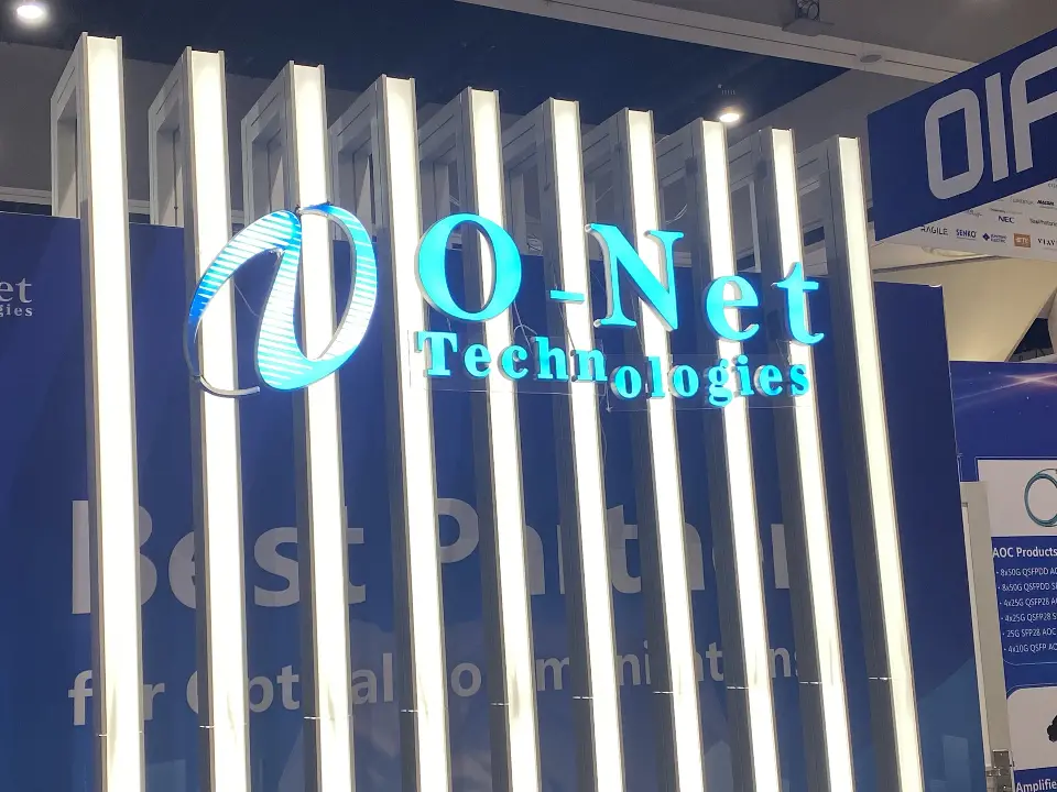 Close view of the O-Net Technologies logo glowing in blue across white lit slats