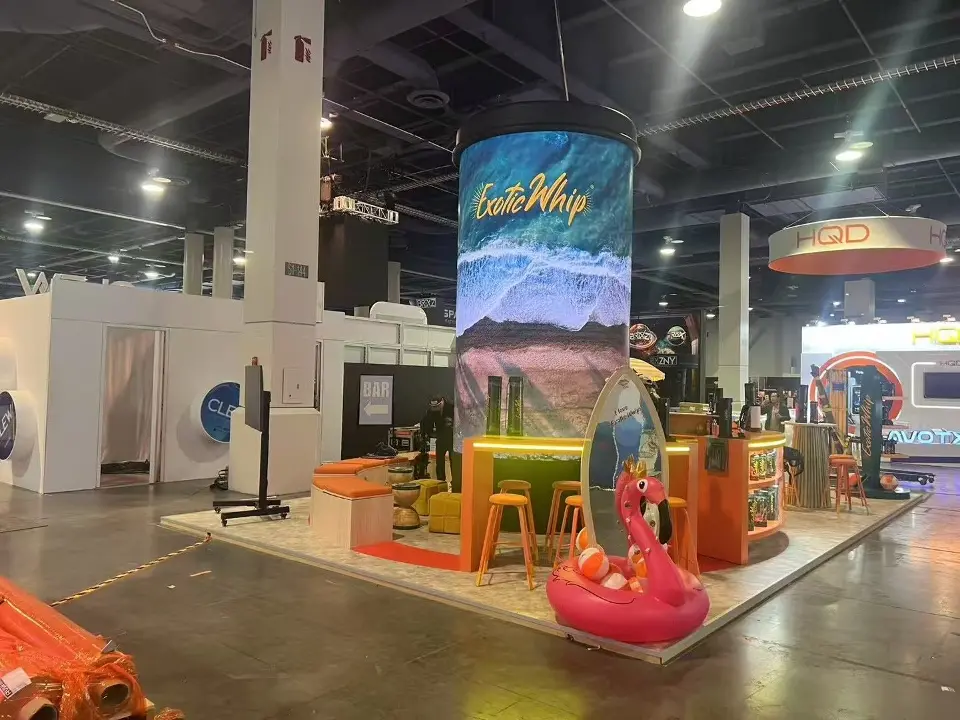 Inflatable flamingo and display shelving below the round video column