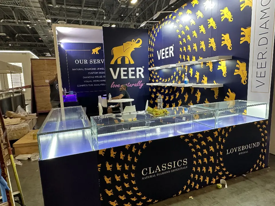 Angled view of Veer counters with elephant graphics and Our Services panel