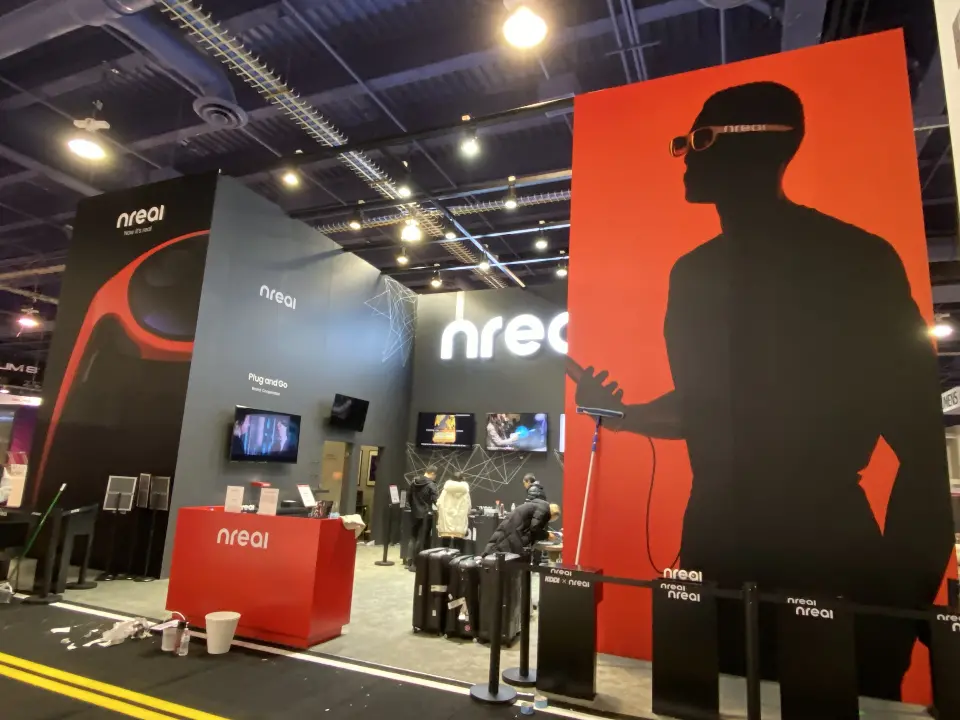 Red nreal counter, wall screens and a tall silhouette graphic in red and black