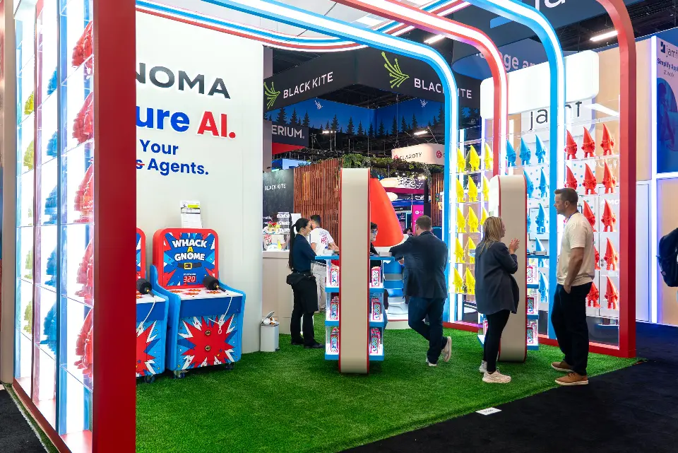 Visitors browsing the gnome shelves and game area inside the arches