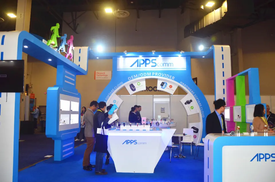 Front of the APPScomm booth with OEM/ODM Provider arch and running-figure sculptures on the roof