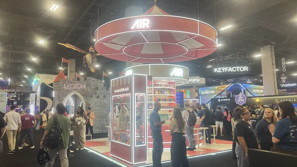 AIR booth with castle-style arch next door and Circus of Skills sign
