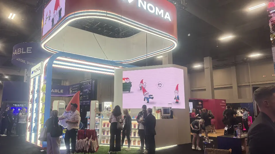 Front angle of the bar counter with visitors and pink screen backdrop