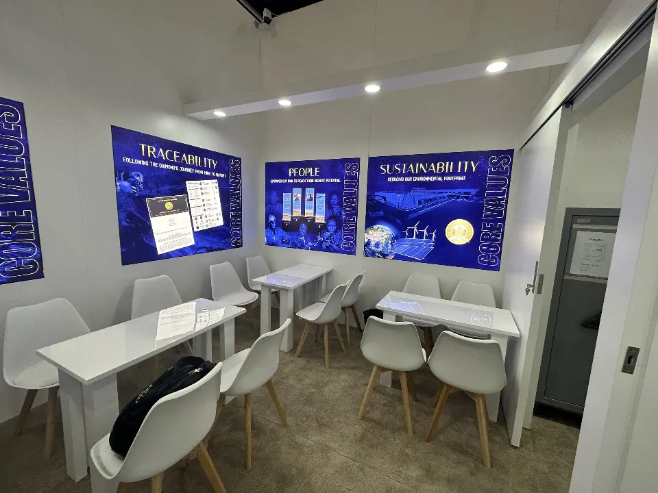 Another meeting room angle with white tables and core-values graphics