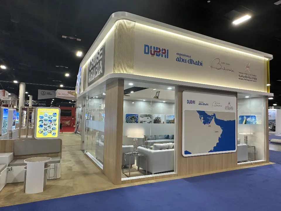 Angled exterior view with glass meeting room and Dubai and Abu Dhabi branding