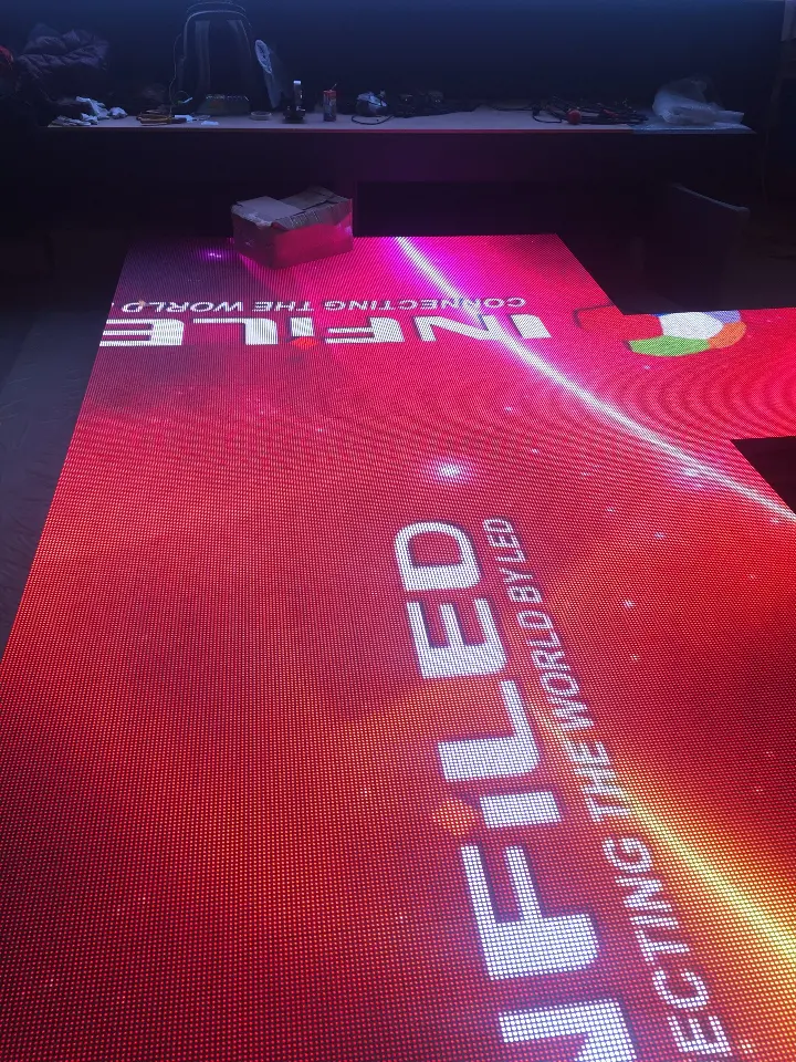 Lit video floor showing red content and the INFiLED name