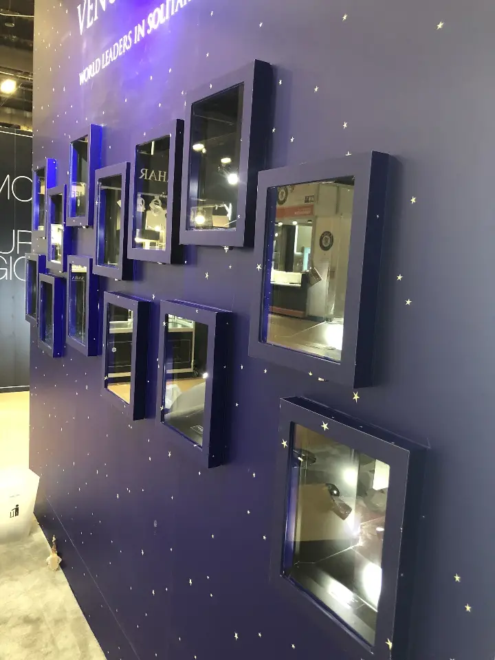Angled starry wall with several recessed lit jewelry niches