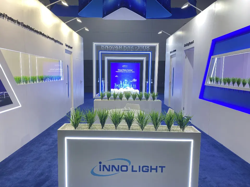 Planter of grasses and InnoLight counter in front of the stepped lit portal