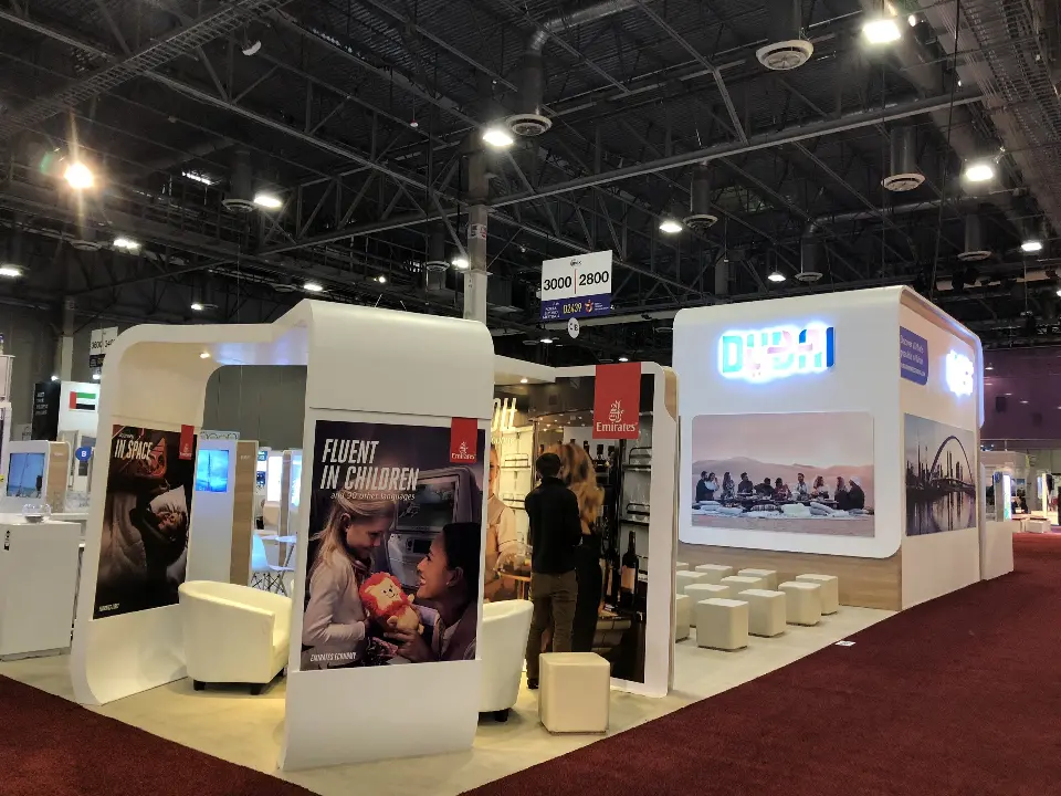 Open lounge section with a large photo panel and white cubes