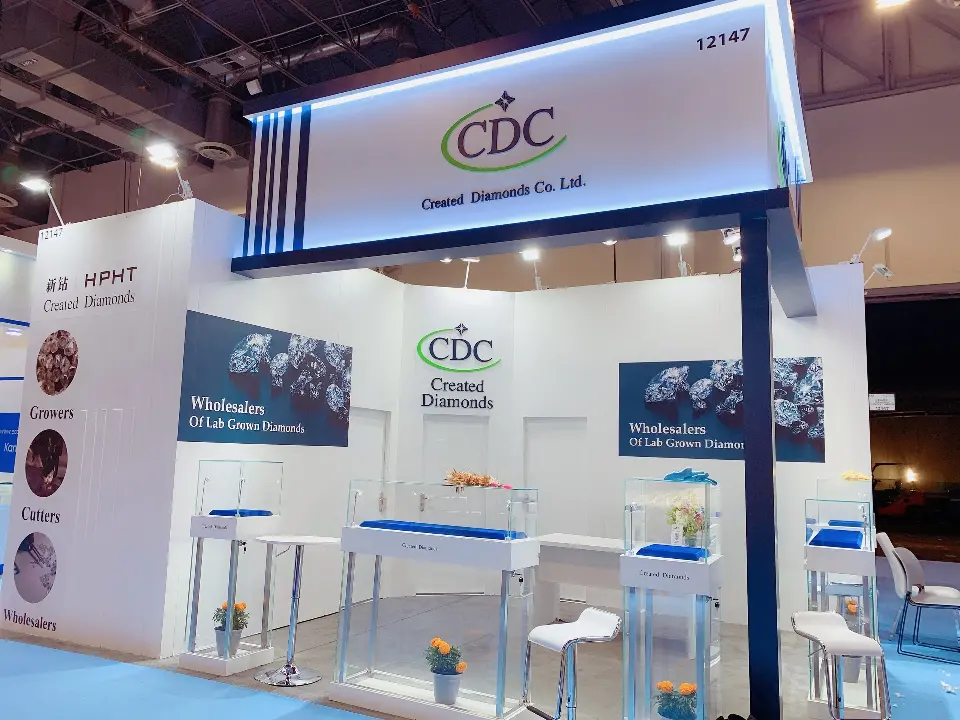 Front view of the CDC square header, diamond graphics and white high tables