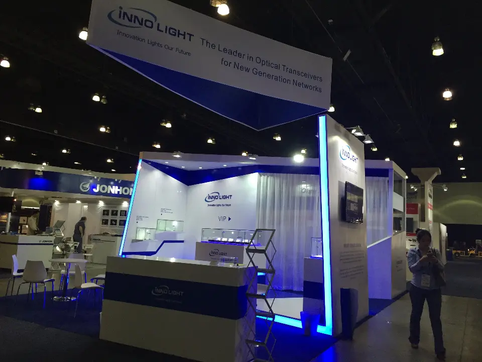 Counter and white walls under the angled blue and white hanging sign