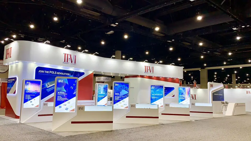 Wide angle of the red and white booth and demo kiosks