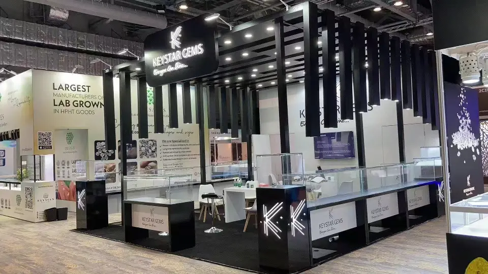 Angled view of the black Keystar Gems frame with hanging slats and clear showcases