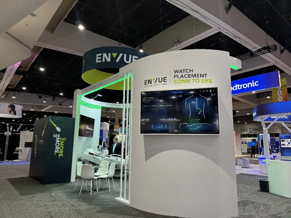 Video tower beside the navy closed room with the ENVUE ring sign overhead