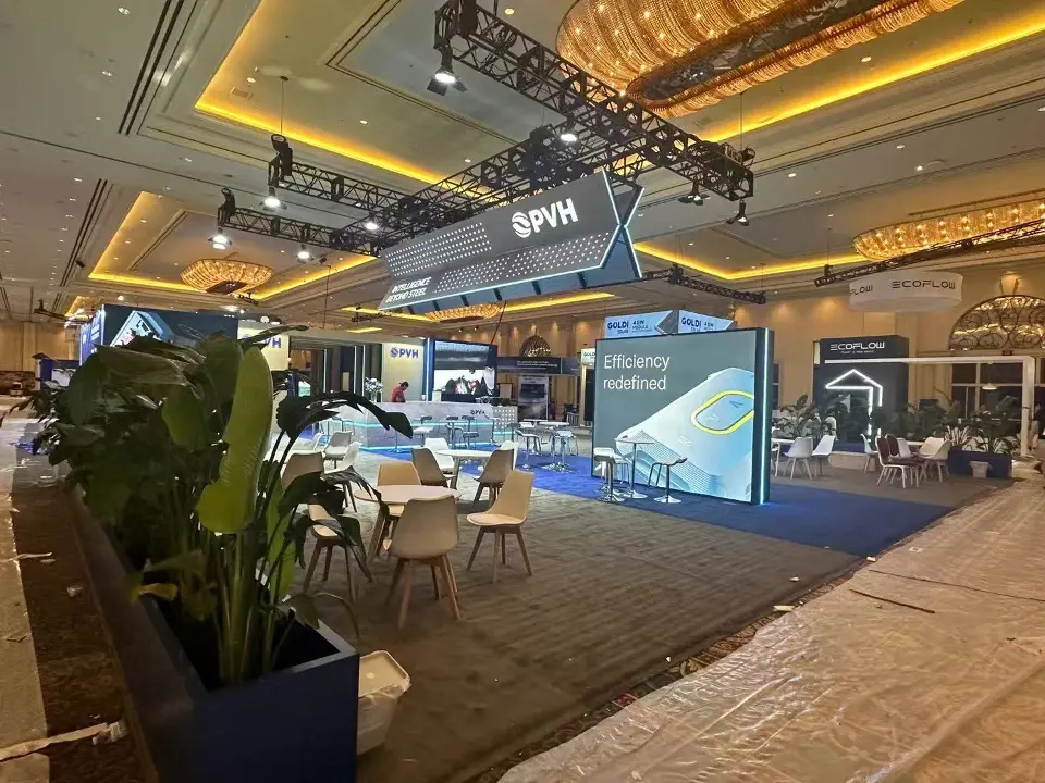 During build-up: PVH meeting area and planters seen from the side with plastic over the carpet