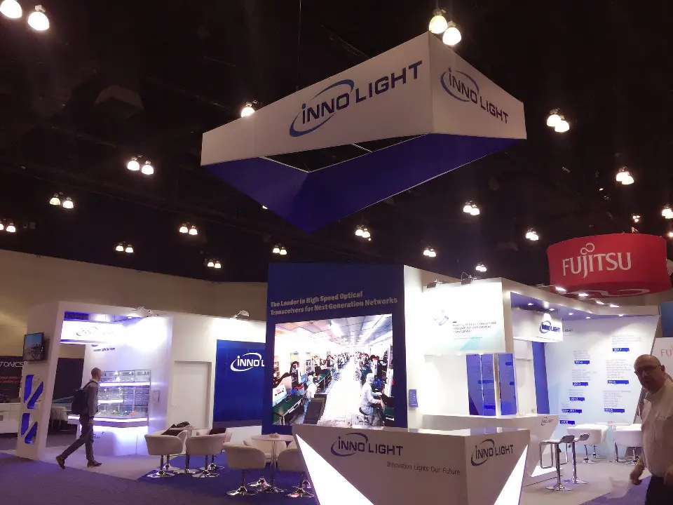 Side view of the booth with seating area and glowing counter