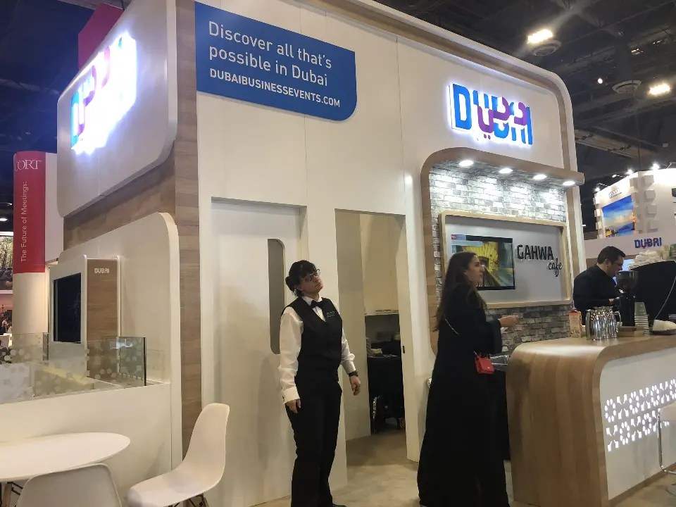 Portrait view of the Dubai discovery panel and wood-look counter with staff