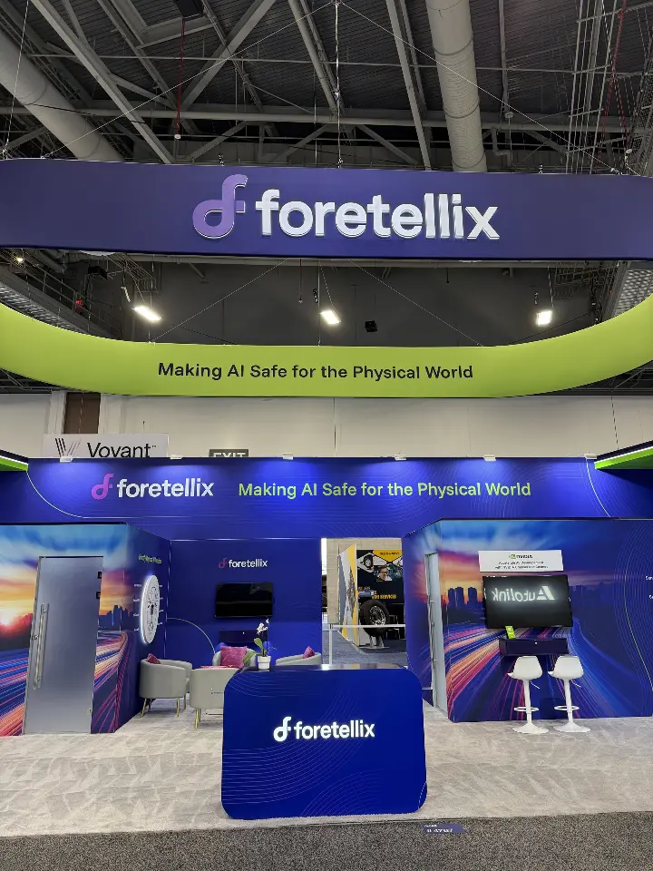 Centered front view with the lime-green ring sweeping over the booth