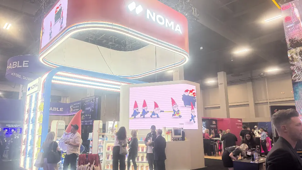 Wider front view showing gnome shelf wall and screen with several gnomes