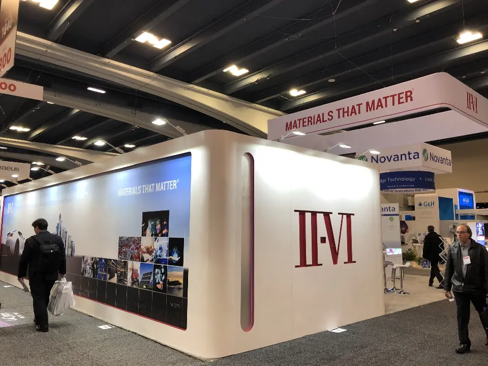 Outer wall end with large II-VI logo and skyline graphic beside the aisle
