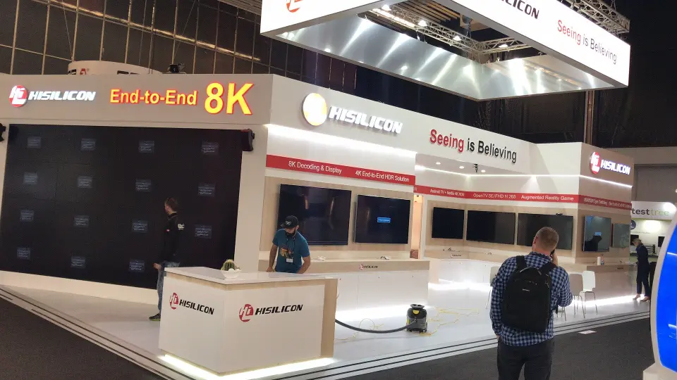 Wider view of the HiSilicon booth under its white suspended sign