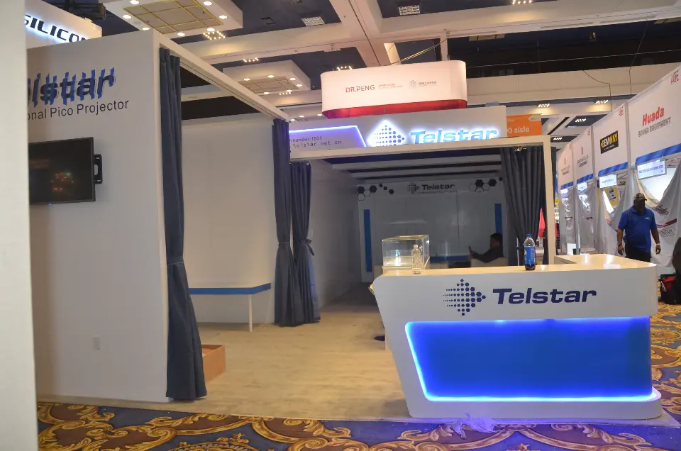 Side view of a white Telstar counter beside a curtained room
