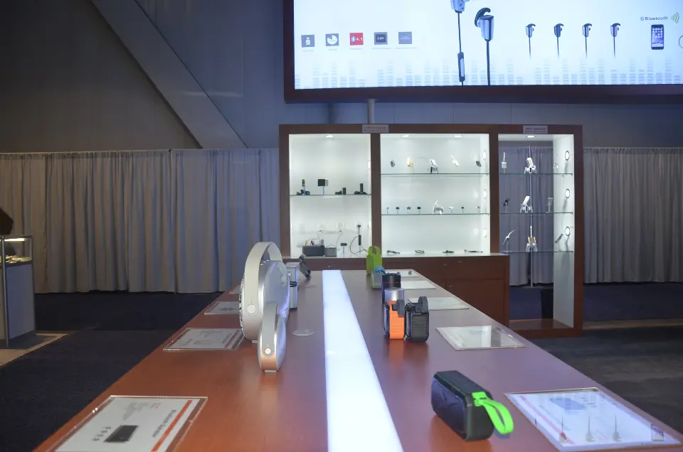 Long counter top with products leading back to the wall shelving