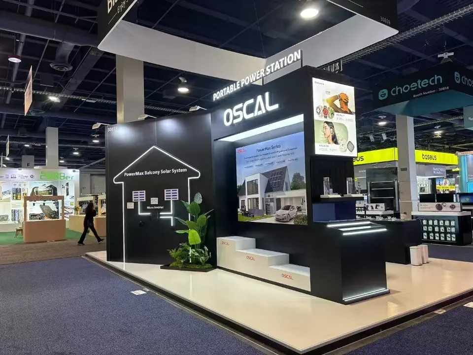 Black booth corner with OSCAL lettering, house outline graphic and white stepped display
