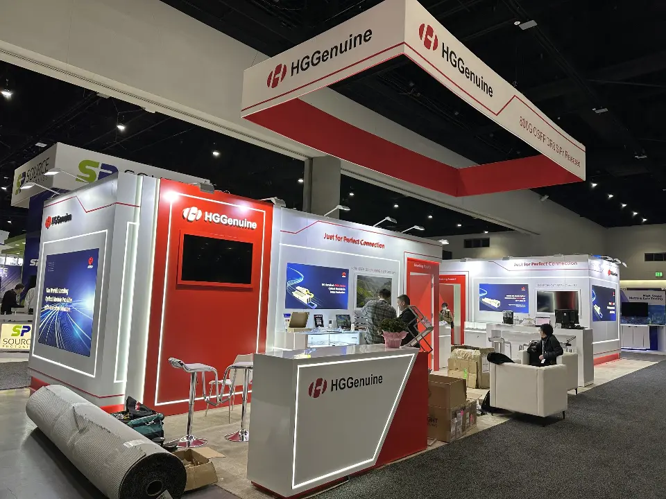 Open product area with video screen, shelves and red panels under the hanging header
