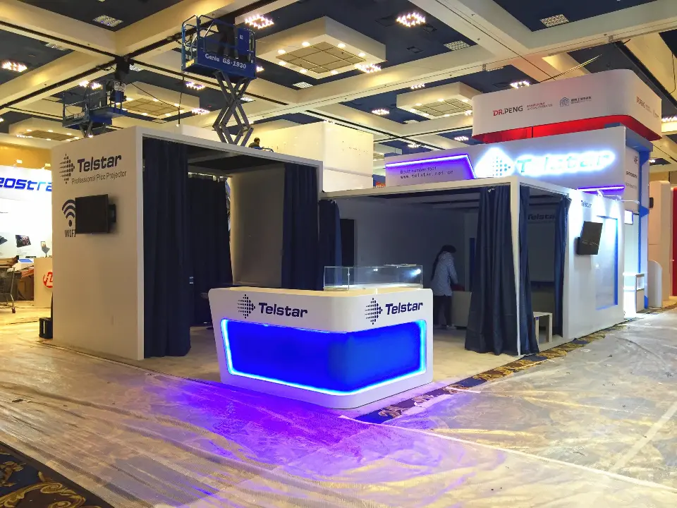 Blue-lit Telstar counter casting a purple glow beside curtained rooms