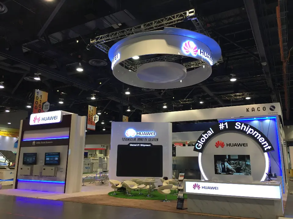 Booth front with the wall screen showing a solar image beside the arch