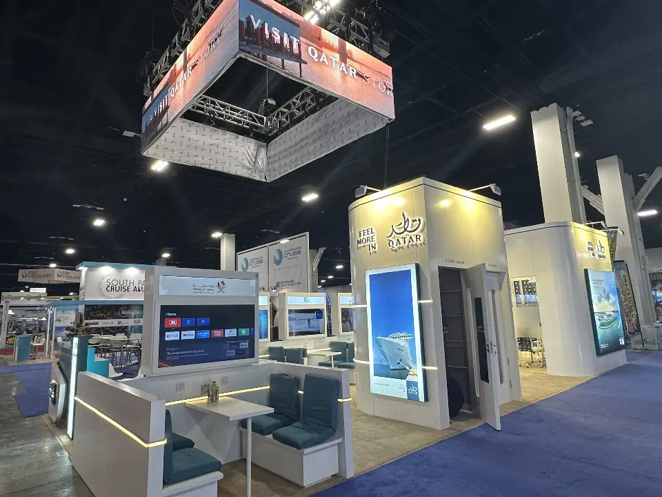 Long view of partner panels and lounge seating under the hanging sign