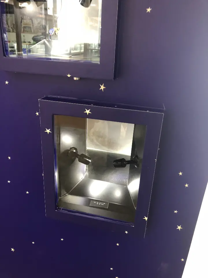 Close-up of one lit square niche set into the starry panel