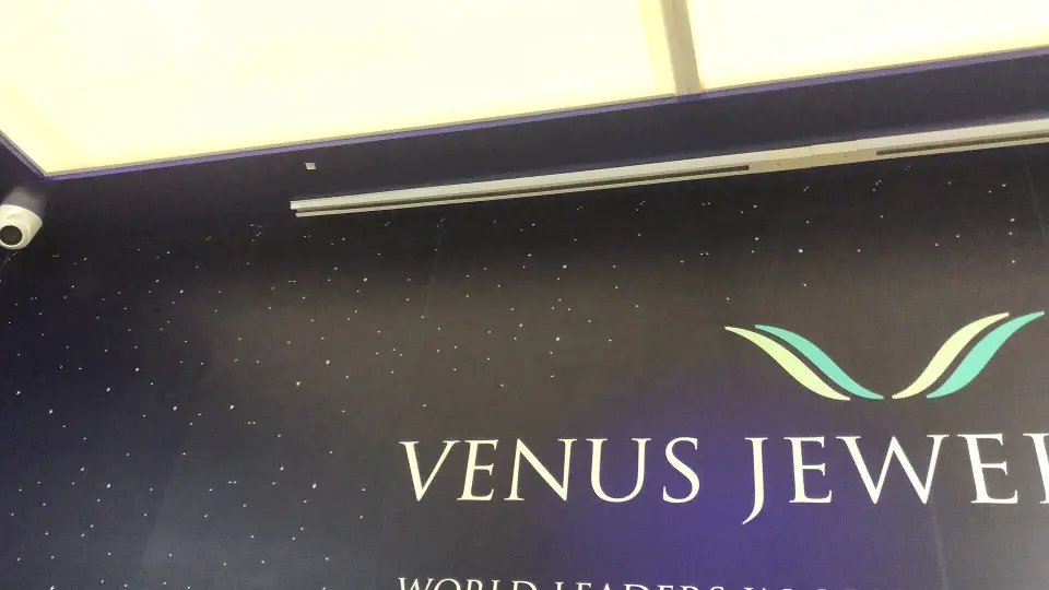 Close-up of the Venus Jewel logo on the fascia below a light strip