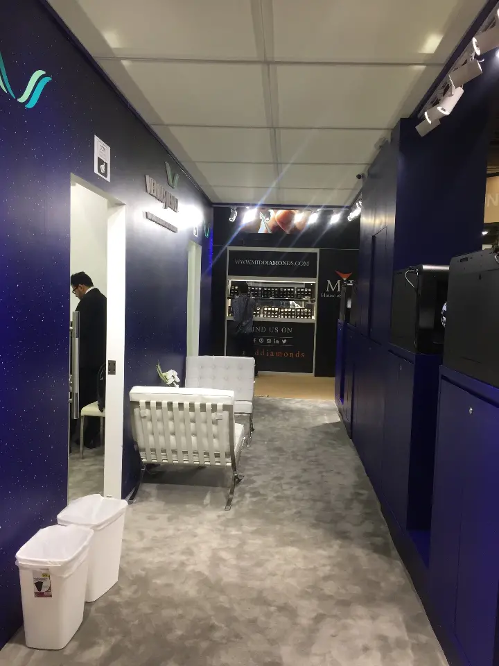 View down the inner passage toward the white lounge and display case