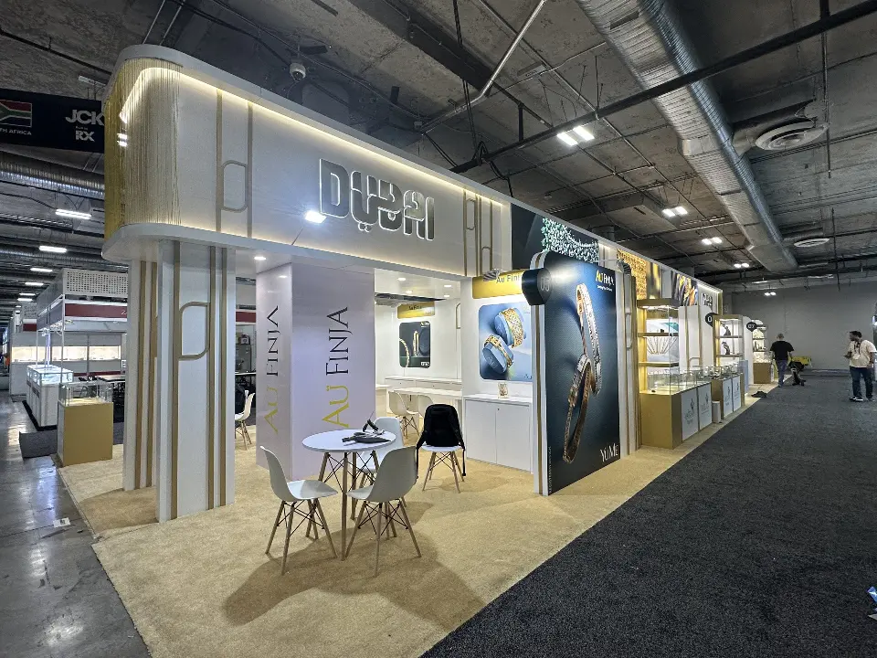 Long view along the carpet edge showing the gold-lined white walls