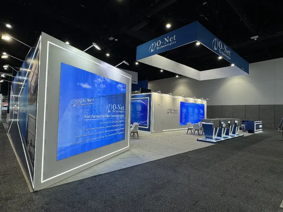 Long white side wall with a large blue product graphic framed by light strips