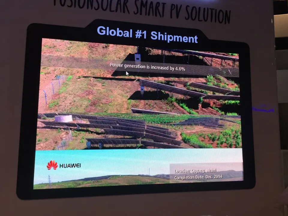 Video screen headed Global #1 Shipment showing solar field imagery, seen straight on