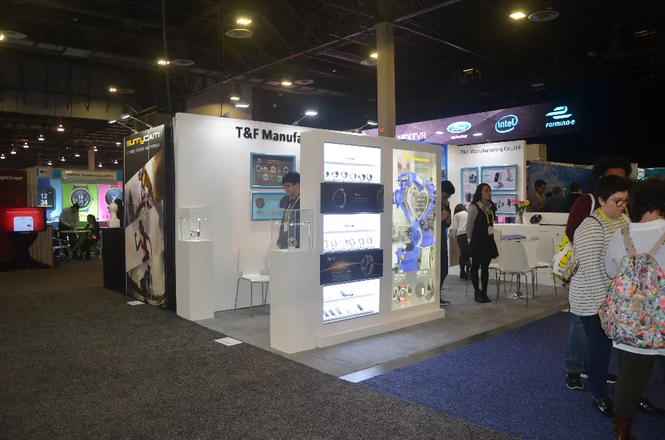 T&F Manufacturing stand at CES 2017 with white walls and a backlit smartwatch display column